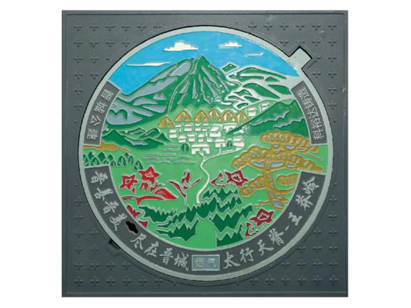 Colour ductile iron art manhole cover cast with a painted mountain landscape